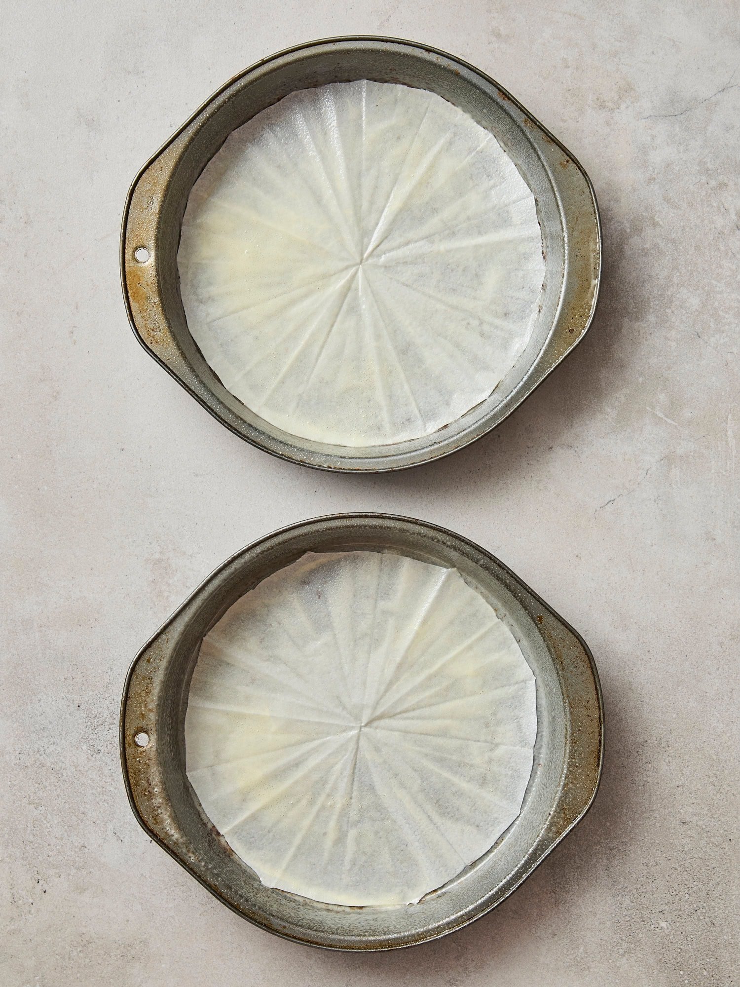 Two cake pans greased.