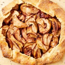 Baked apple galette with crust around edges right after coming out of the oven.