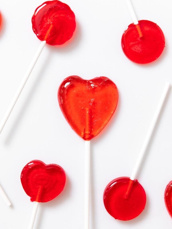 Top down view of white countertop sit red colored suckers