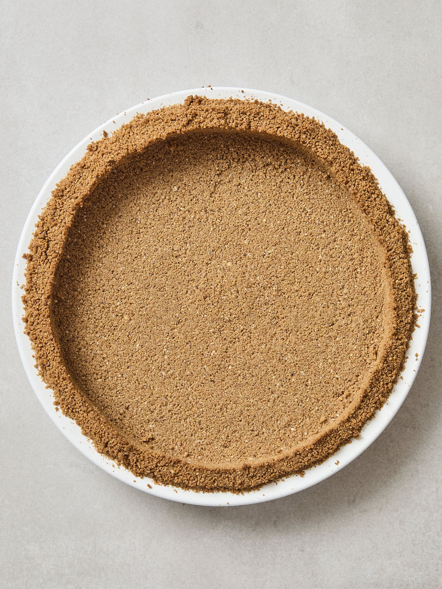 Baked crust for a pumpkin cheesecake.