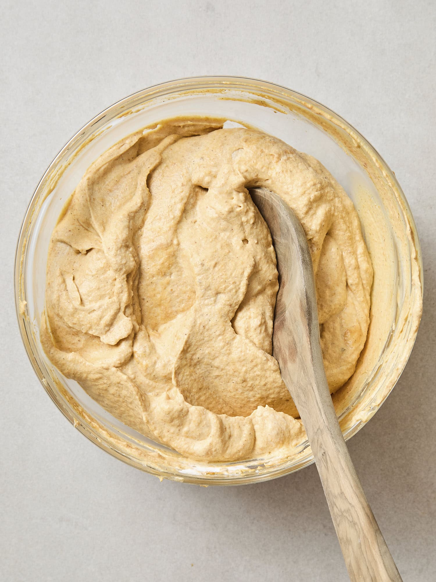 Fluffy pumpkin filling in a glass bowl.