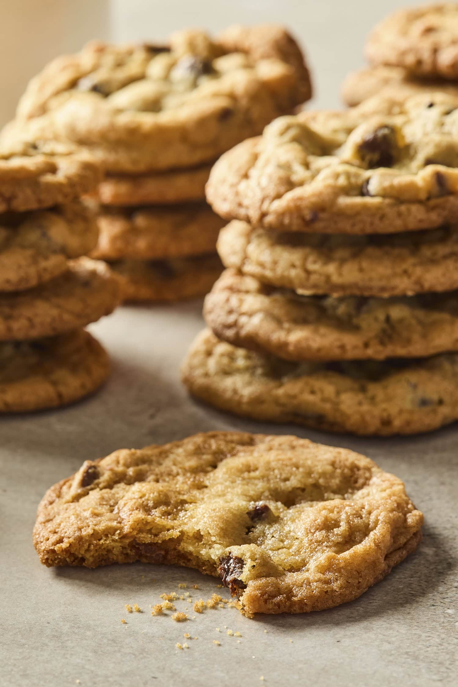 Stacks of cookies with one with a bite out.
