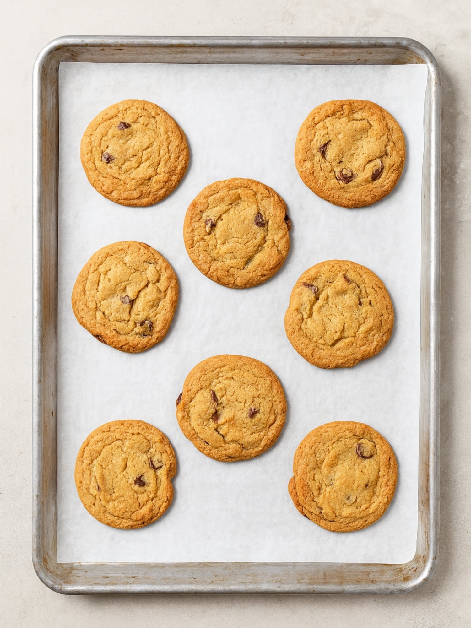 Pan of baked chocolate chip cookies.