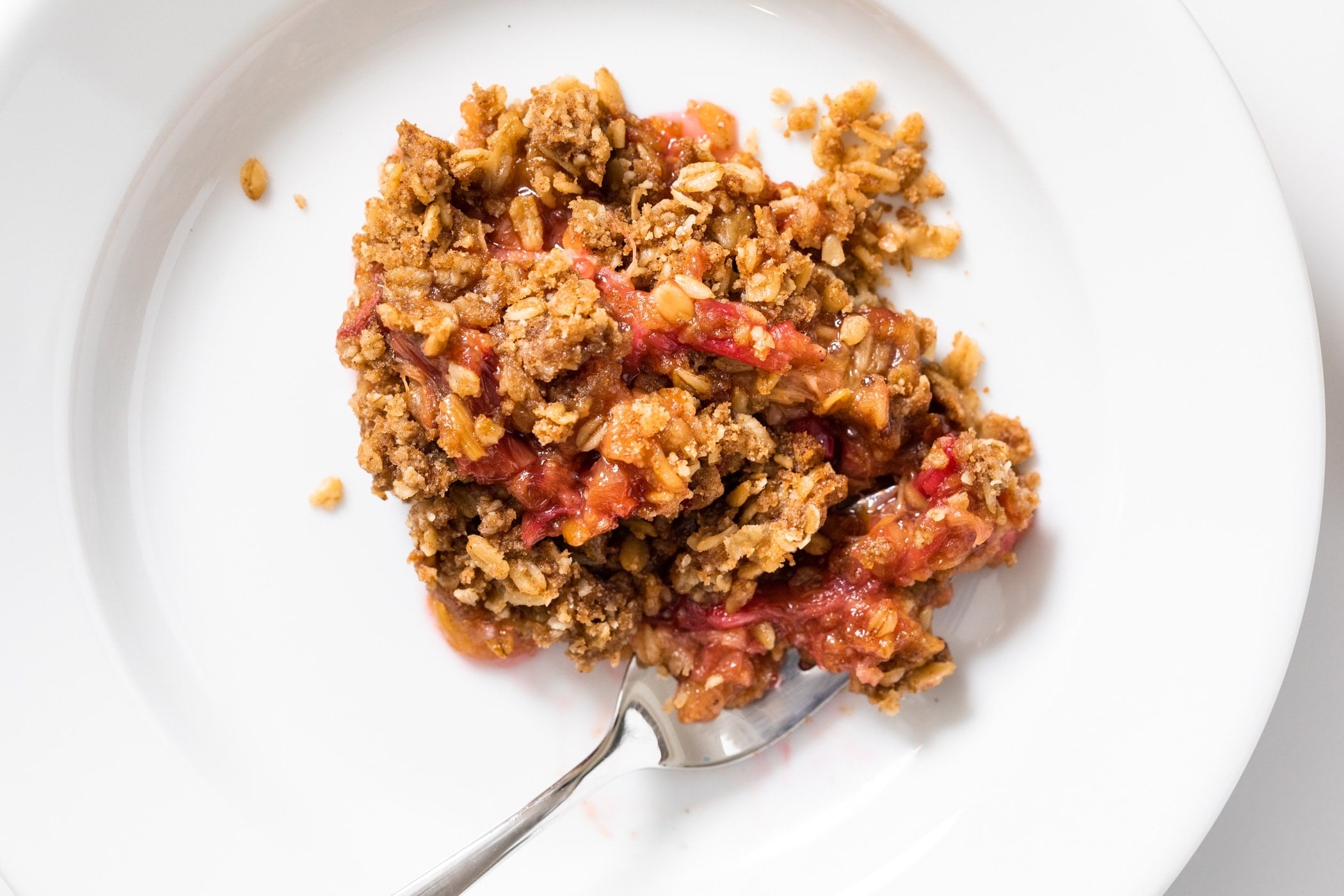 White plate with rhubarb crisp.
