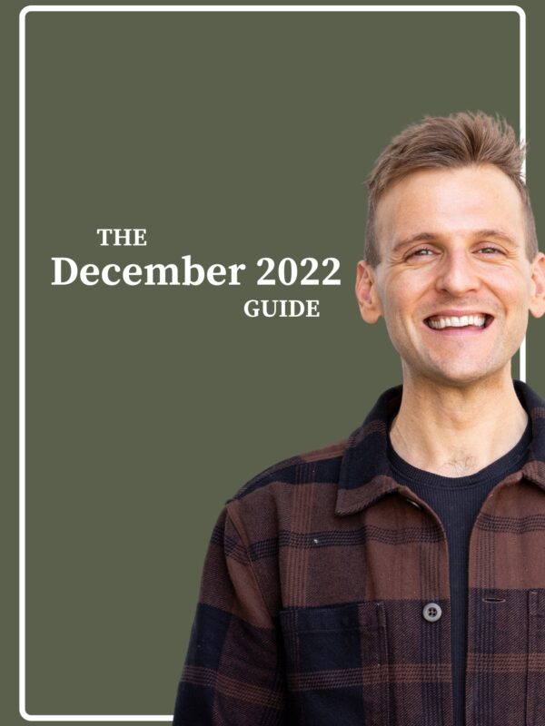 Kaleb Wyse wearing brown and black plaid shirt standing in front of dark green background with the words "The December 2022 Guide".