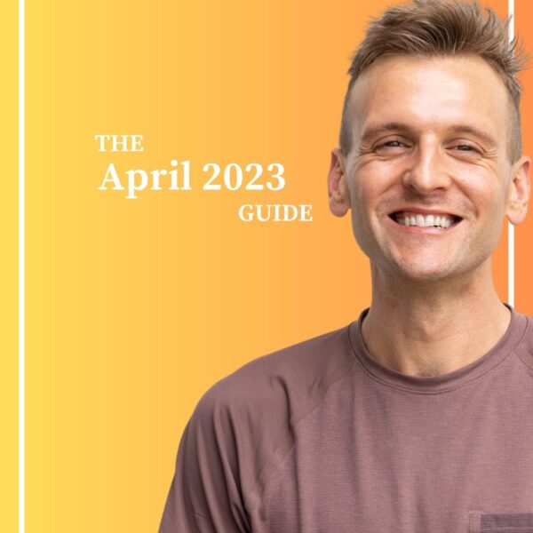 Kaleb Wyse standing in front of yellow and orange gradient background with the words "The April 2023 Guide".