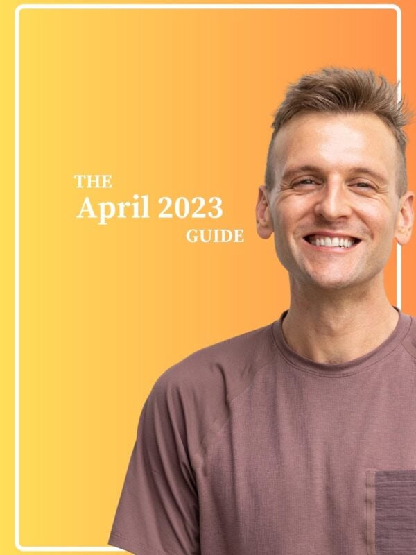 Kaleb Wyse standing in front of yellow and orange gradient background with the words "The April 2023 Guide".