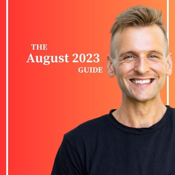 Kaleb Wyse smiling wearing black shirt standing in front of an orange and red gradient background with the words " The August 2023 Guide".