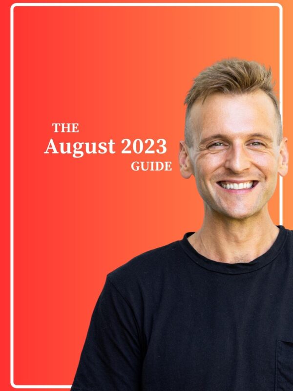 Kaleb Wyse smiling wearing black shirt standing in front of an orange and red gradient background with the words " The August 2023 Guide".