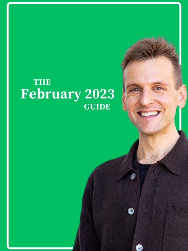 Kaleb Wyse wearing dark gray buttoned shirt standing in front of green background.