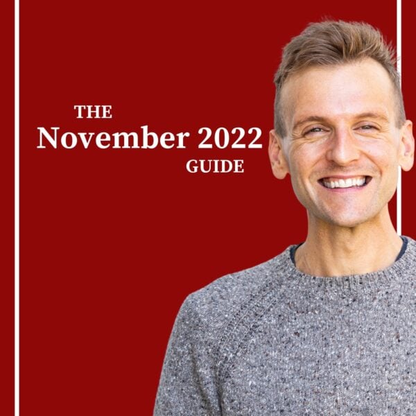 Kaleb Wyse wearing gray sweater standing in front of red background with words "The November 2022 Guide".