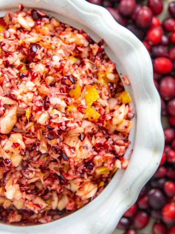 An overhead view of cranberry relish in a white decorative dish.