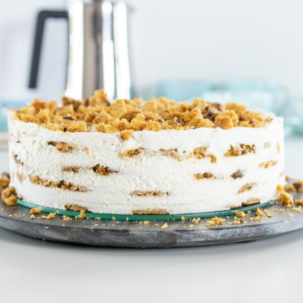 A cookie cake sits on a table.