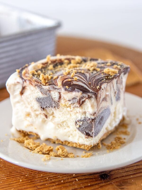 A slice of s'mores cake on a plate.
