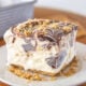 A slice of s'mores cake on a plate.