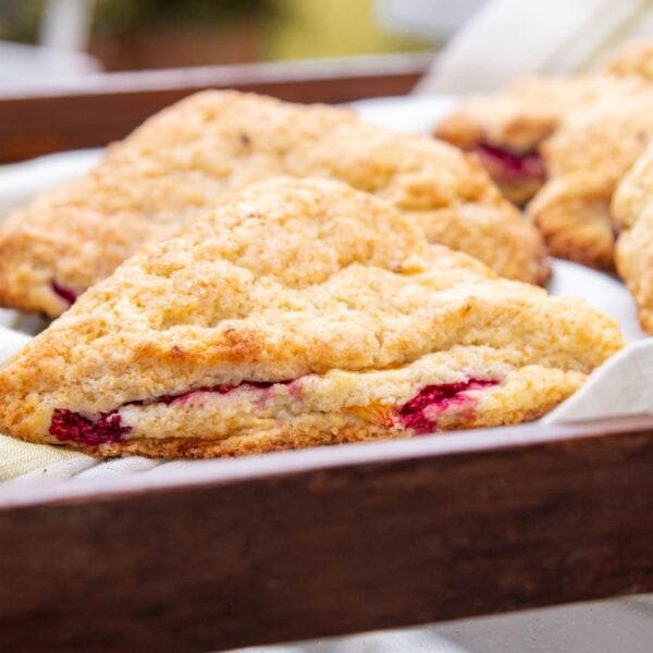 Scones sit in a row on a serving tray.