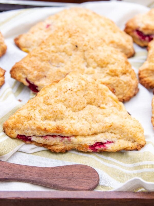 A scone sits on a serving tray.