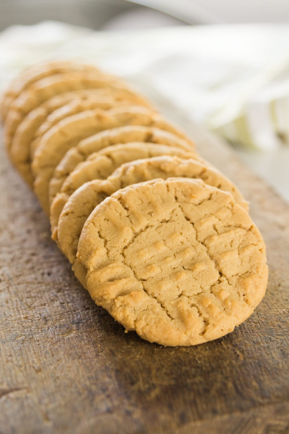 Peanut butter cookies lie in a row.