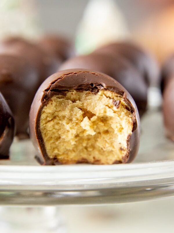 A cross section of a truffle, revealing peanut butter inside.