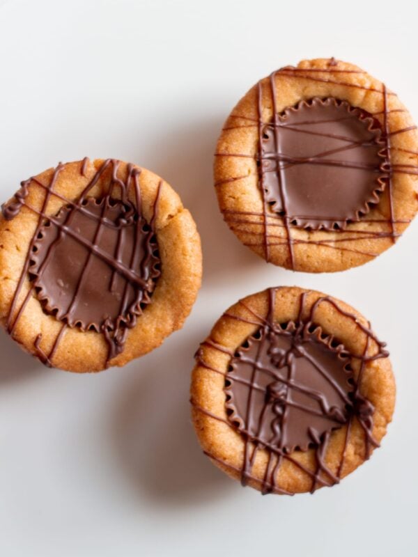 Peanut butter cup cookies sit on a table.
