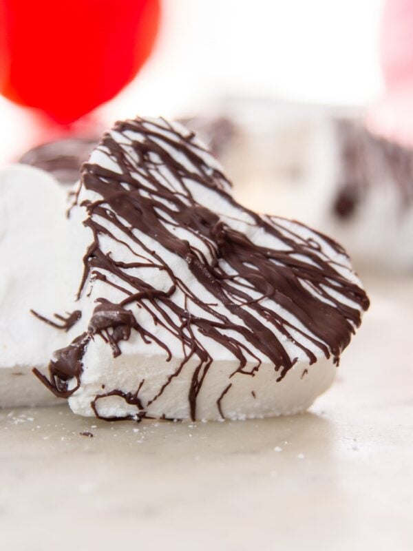 A heart-shaped marshmallow on a table.