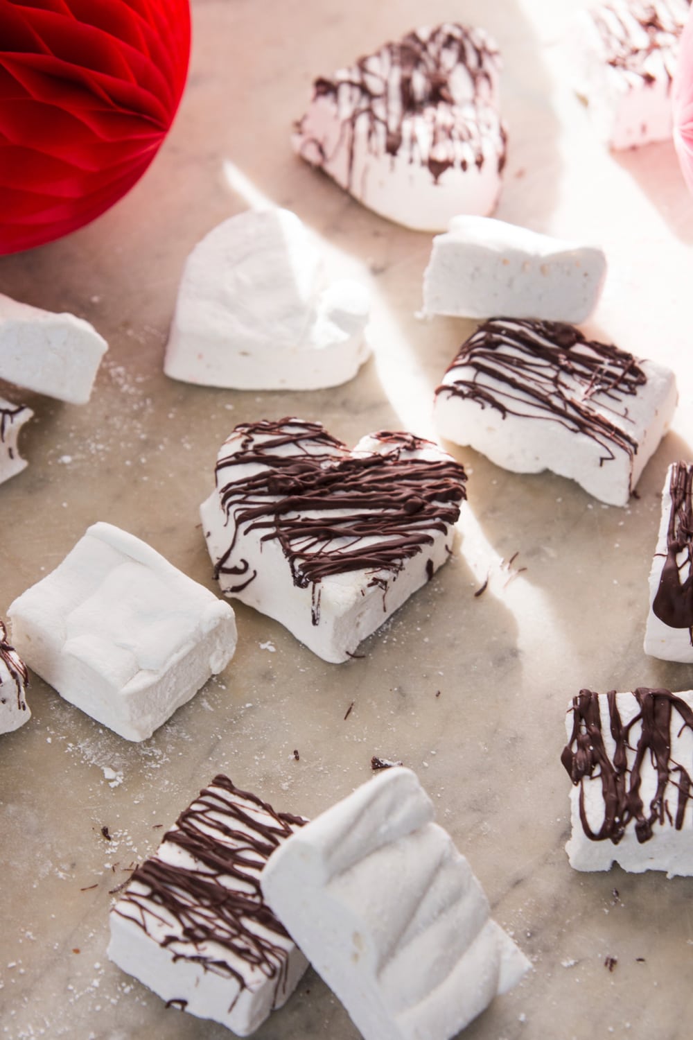 Marshmallow treats sit on a table.