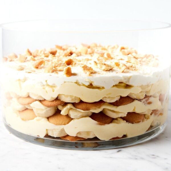 Marble surface with trifle dish filled with banana pudding before being served.
