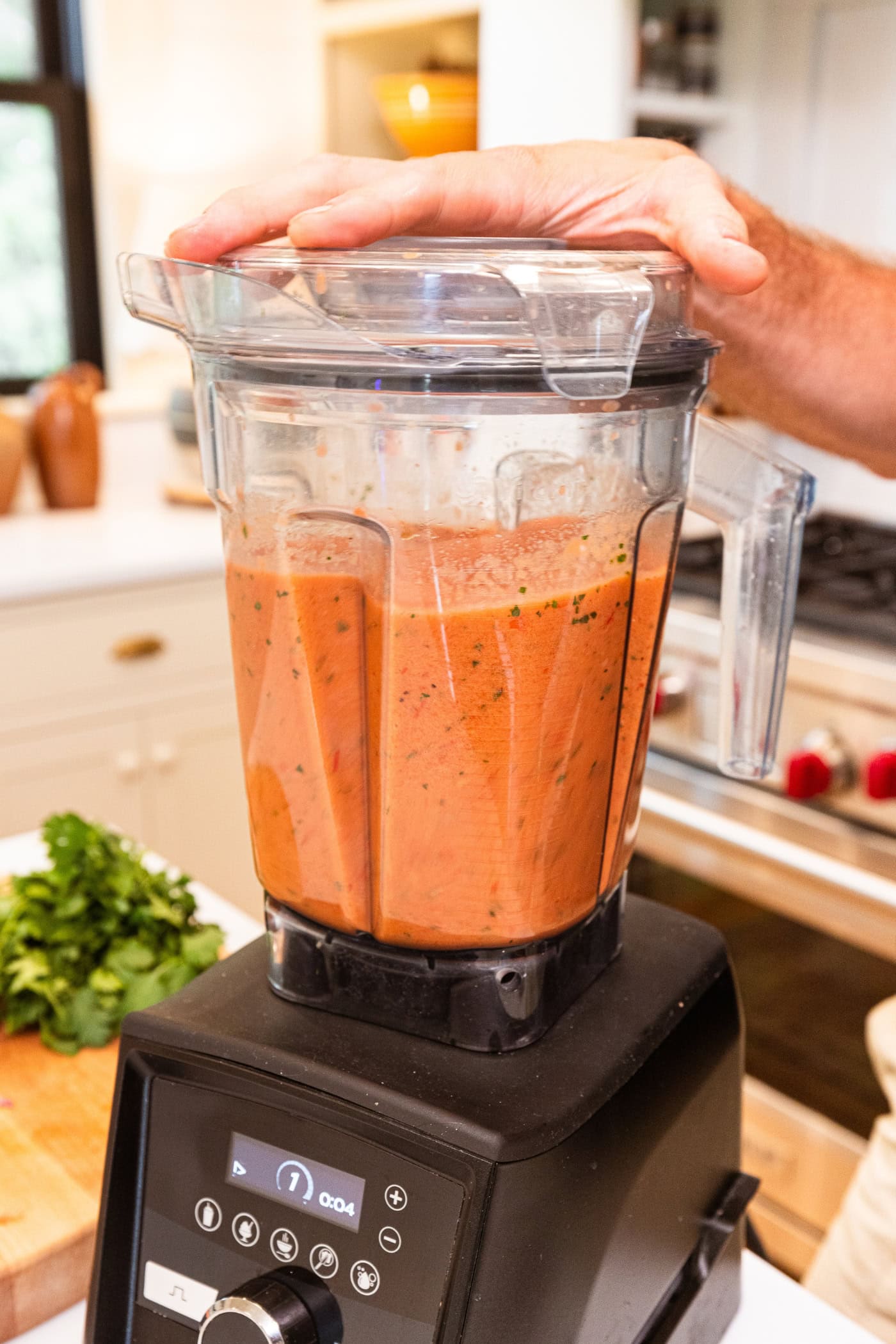 Blender with lid on after blending up gazpacho soup.