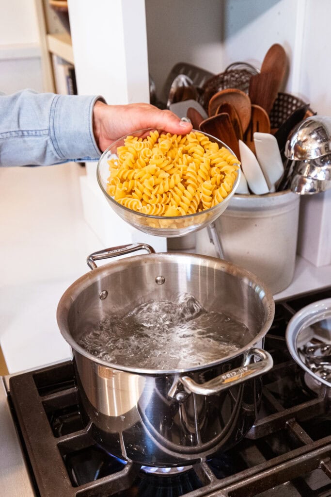 Pasta gets placed into boiling water.