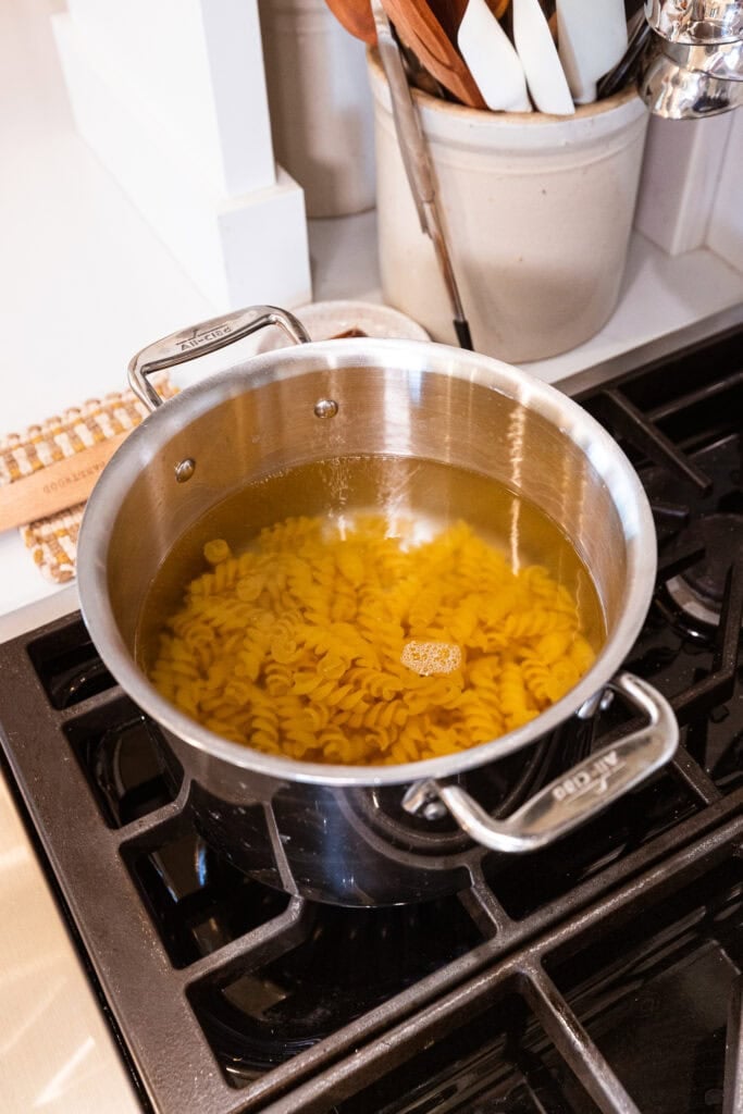 Pasta cooks in boiling water.