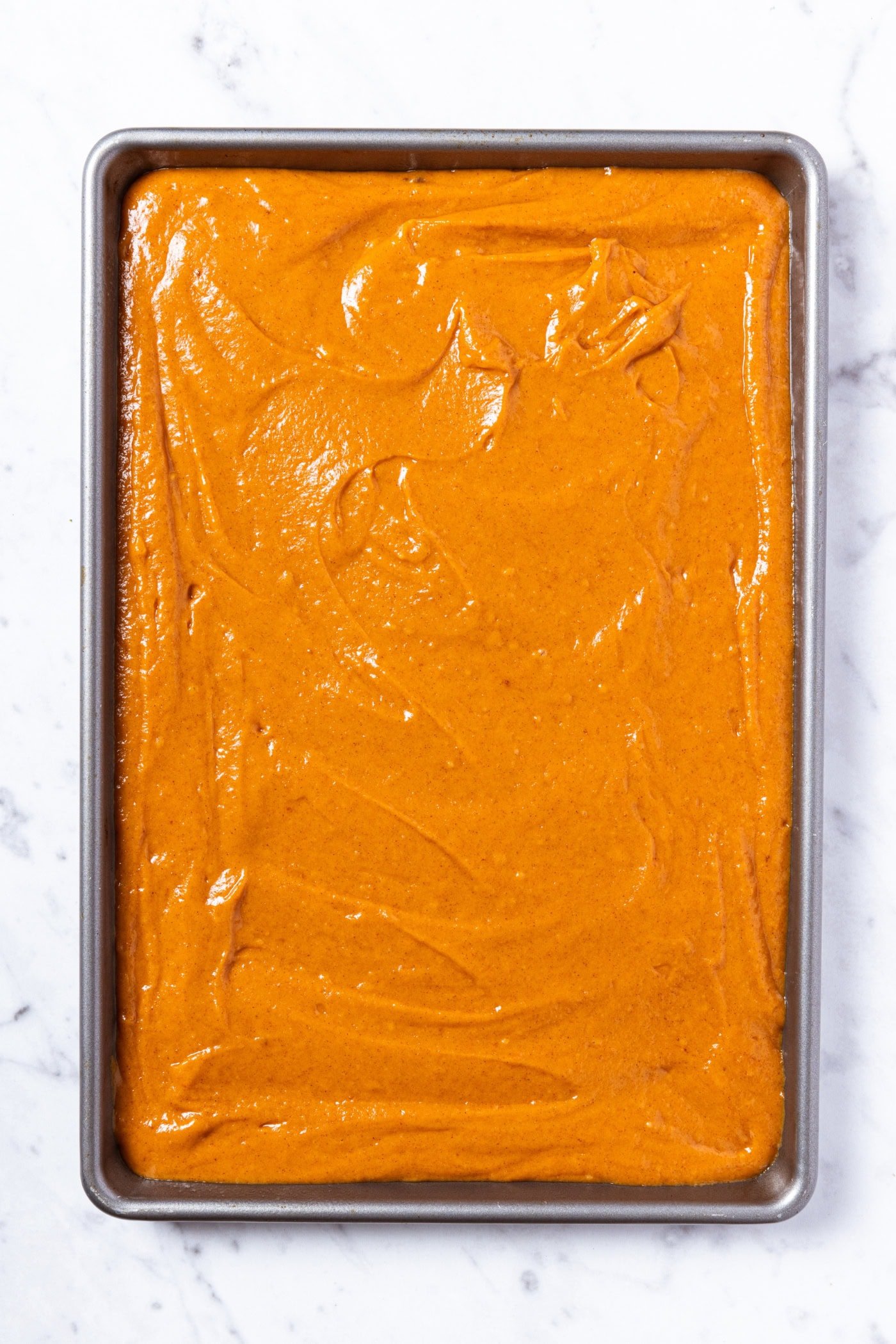 Pan filled with pumpkin bars batter before going into the oven to bake.