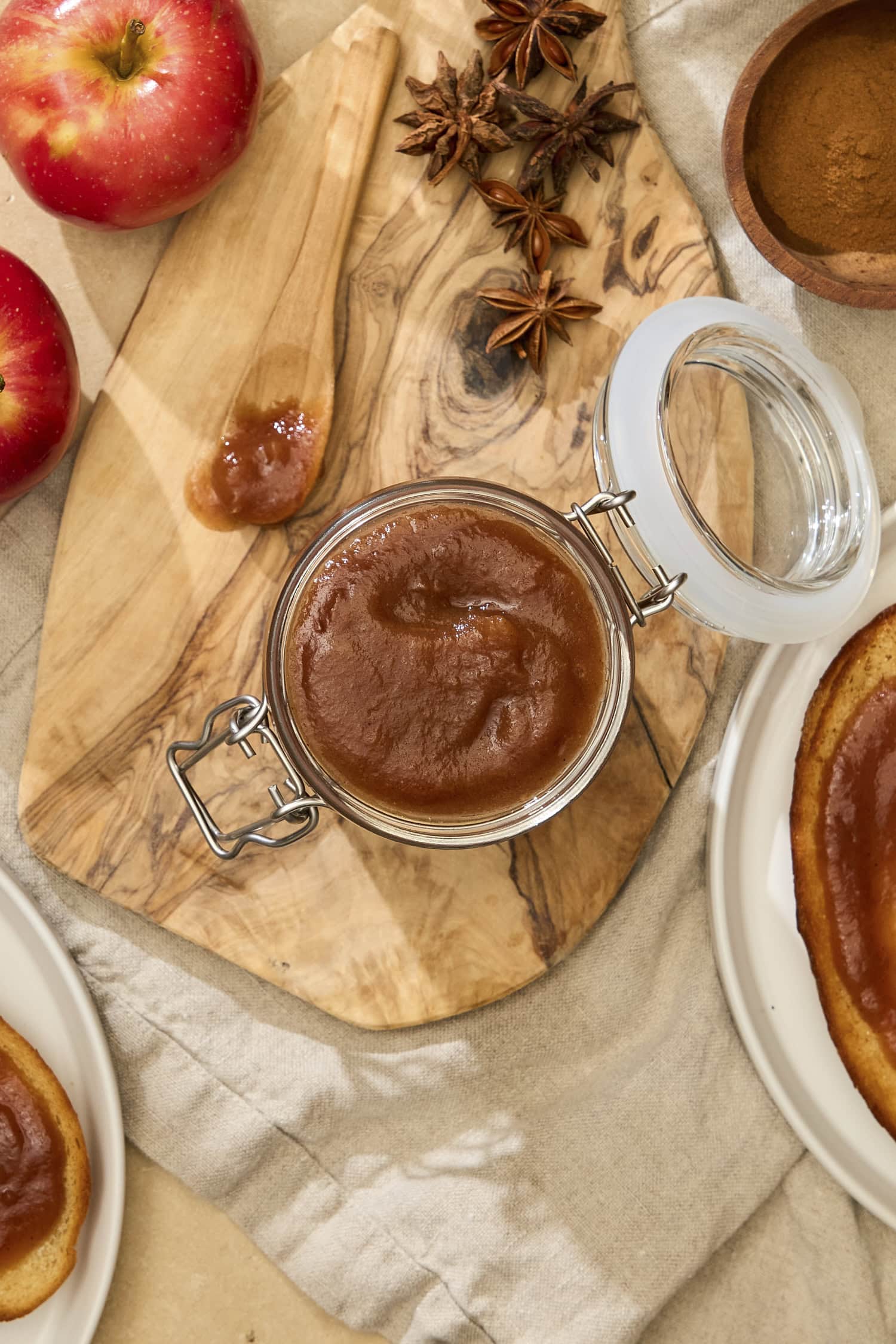 Creamy brown-colored apple butter in jar.