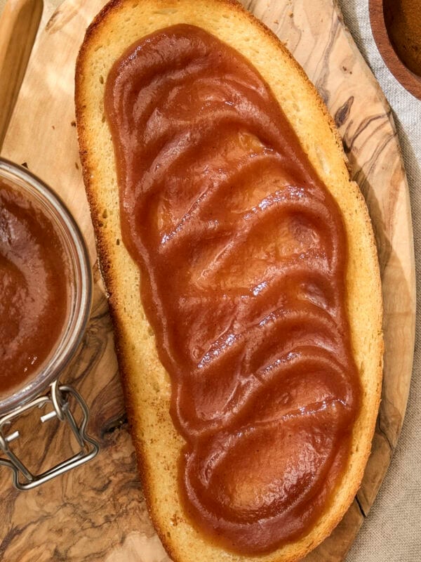 Creamy apple butter spread on a piece of toast.