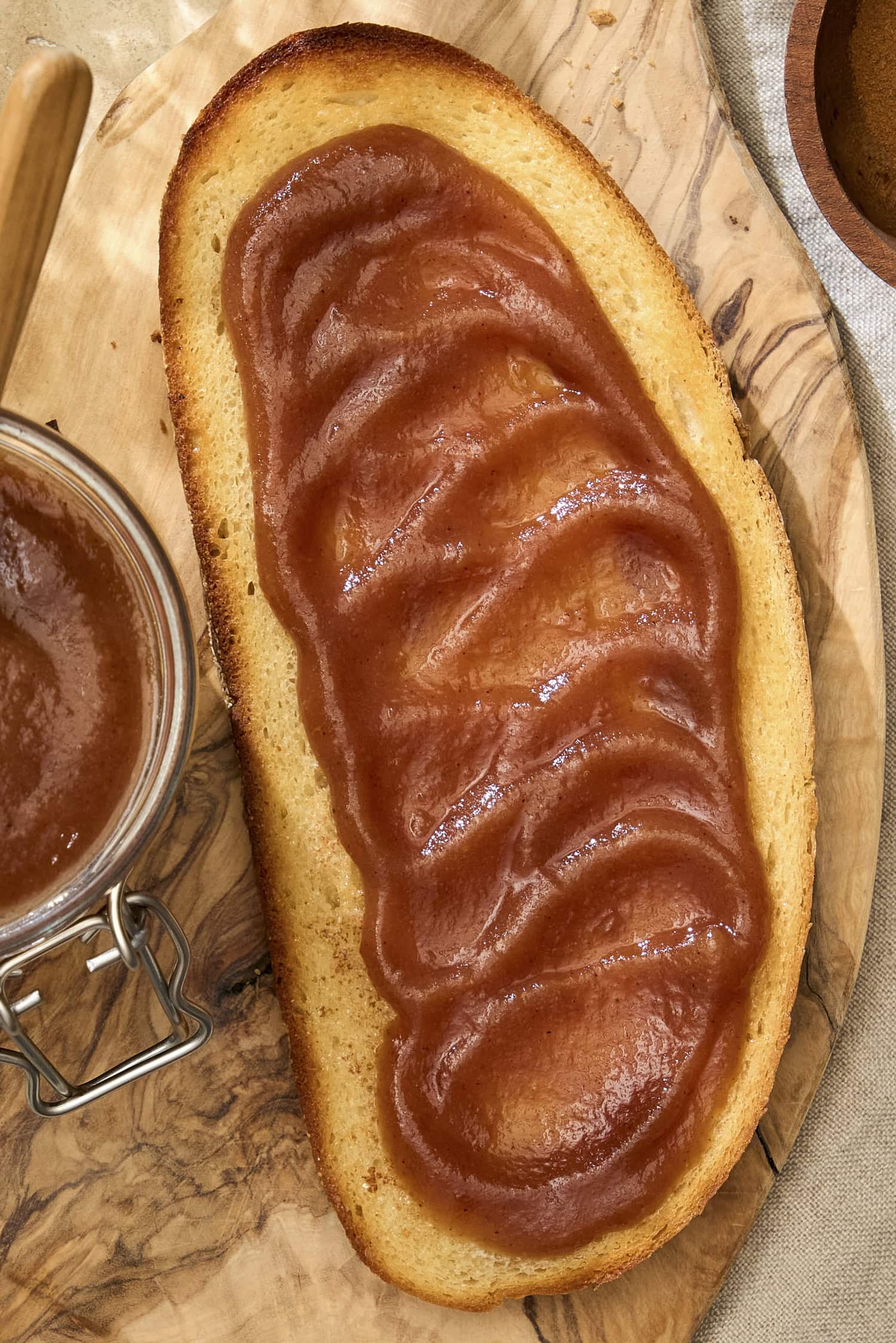 Creamy apple butter spread on a piece of toast.
