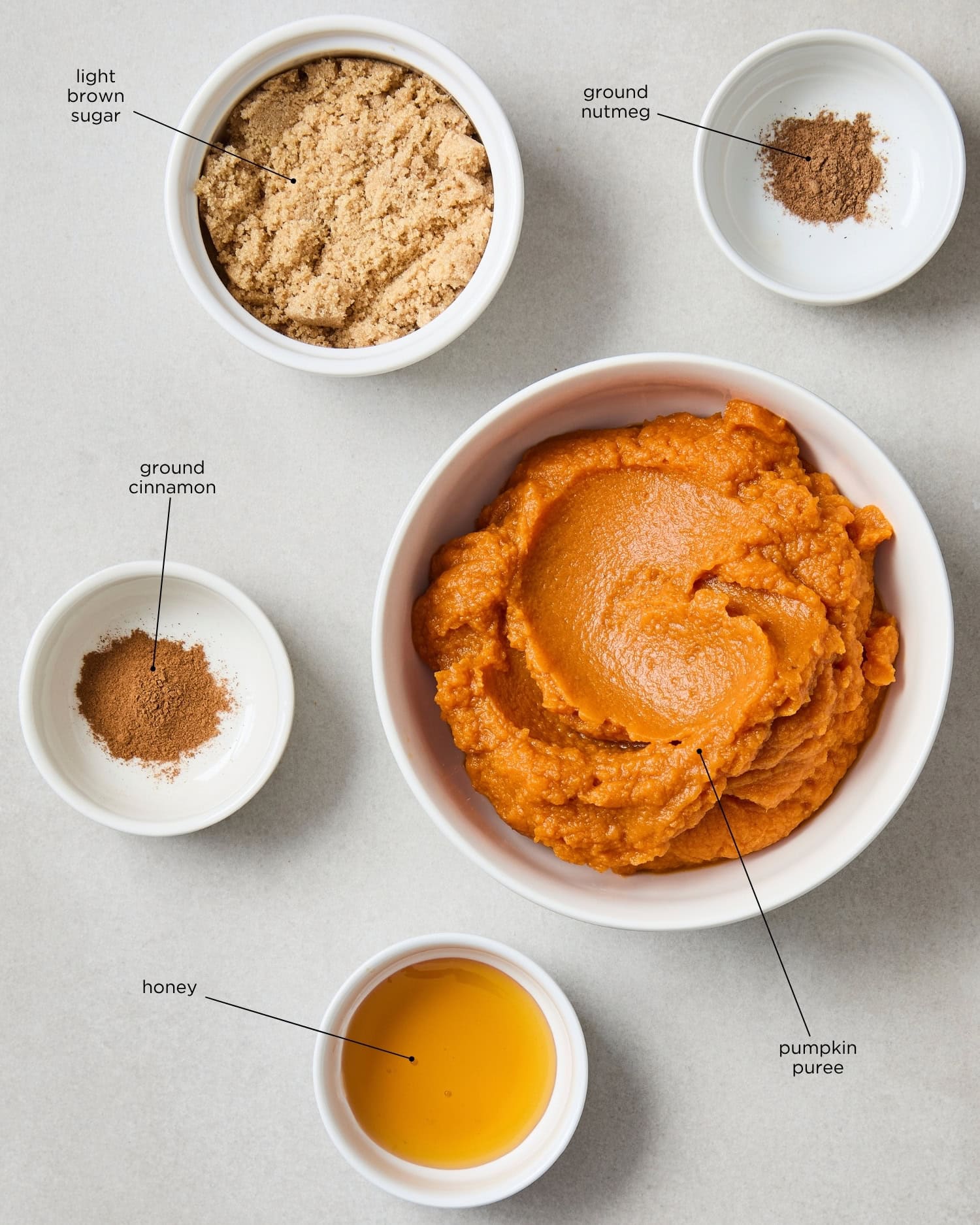 Concrete surface with ingredients needed for making pumpkin butter spread.