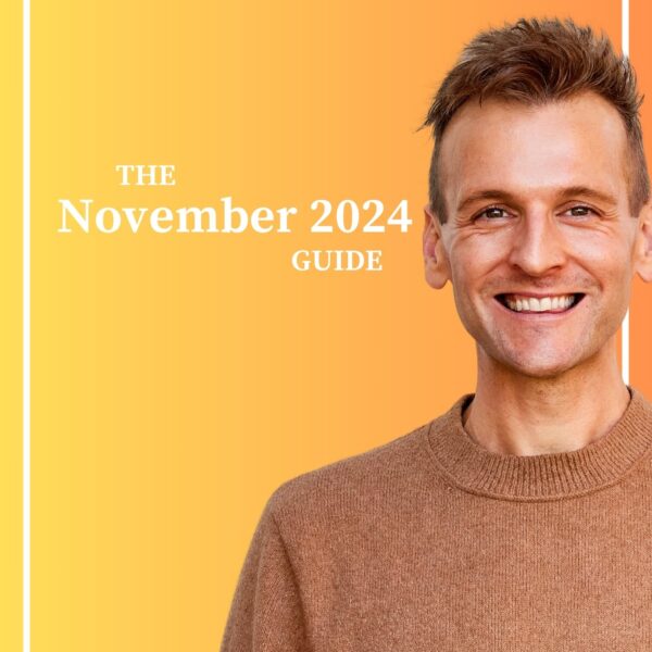 Kaleb Wyse wearing a brown sweater standing in front of orange background with the words "The November 2024 Guide".