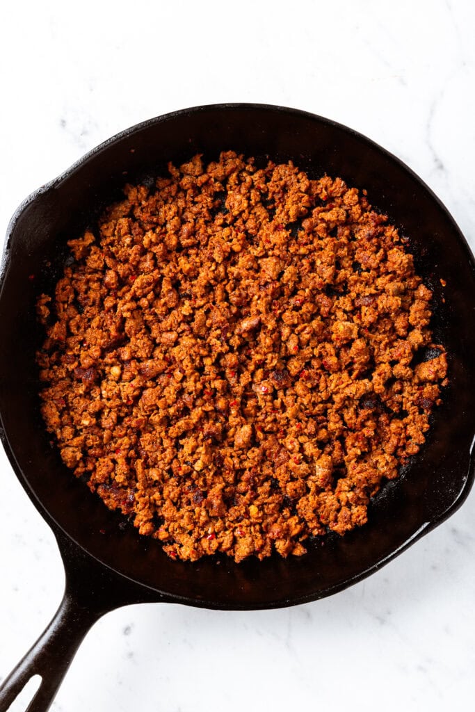 Browned sausage in a skillet.