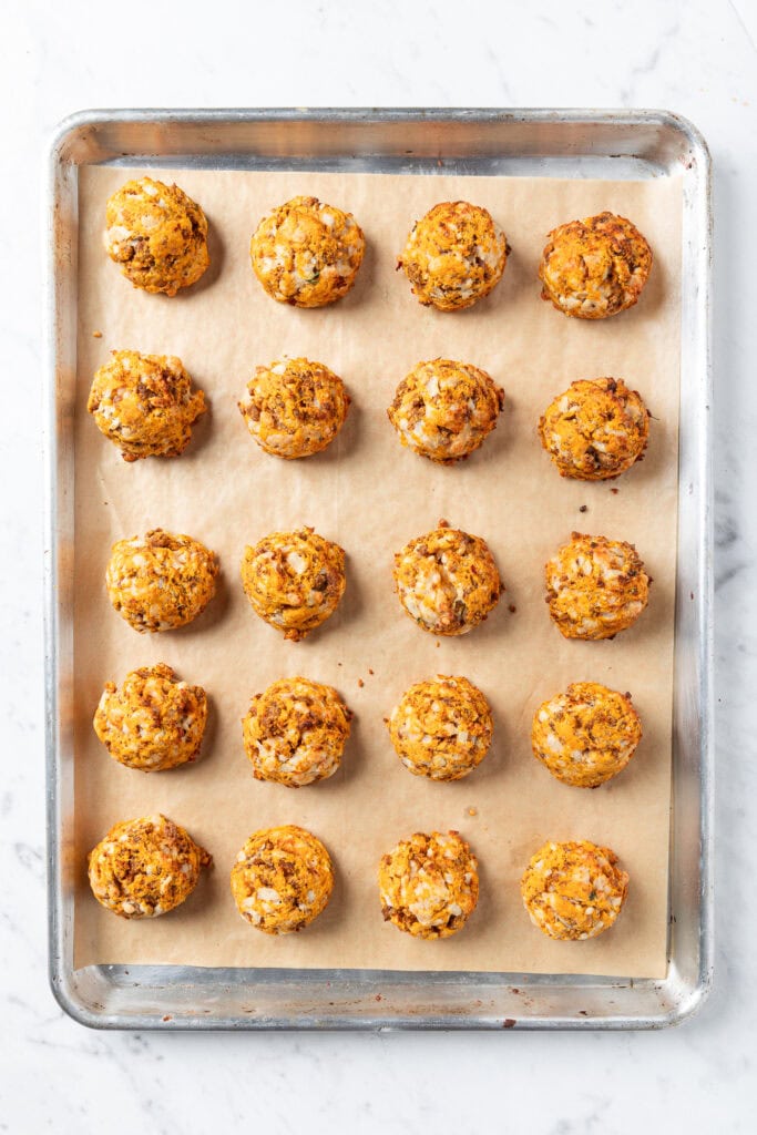 Baked sweet potato puffs on a baking tray.