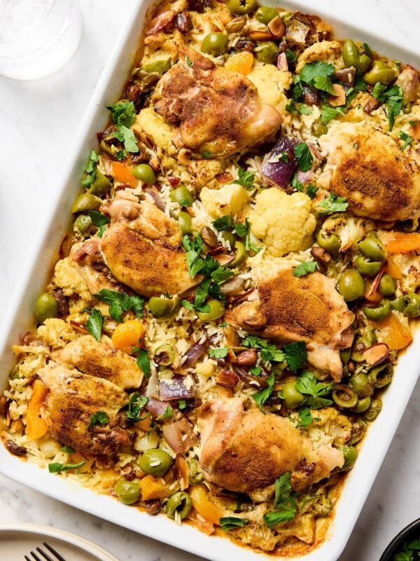 Roasted chicken and rice pilaf with olives, apricots, and red onion.