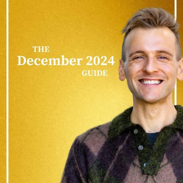 Kaleb Wyse wearing sweater standing in front of gold background with the words "The December 2024 Guide".