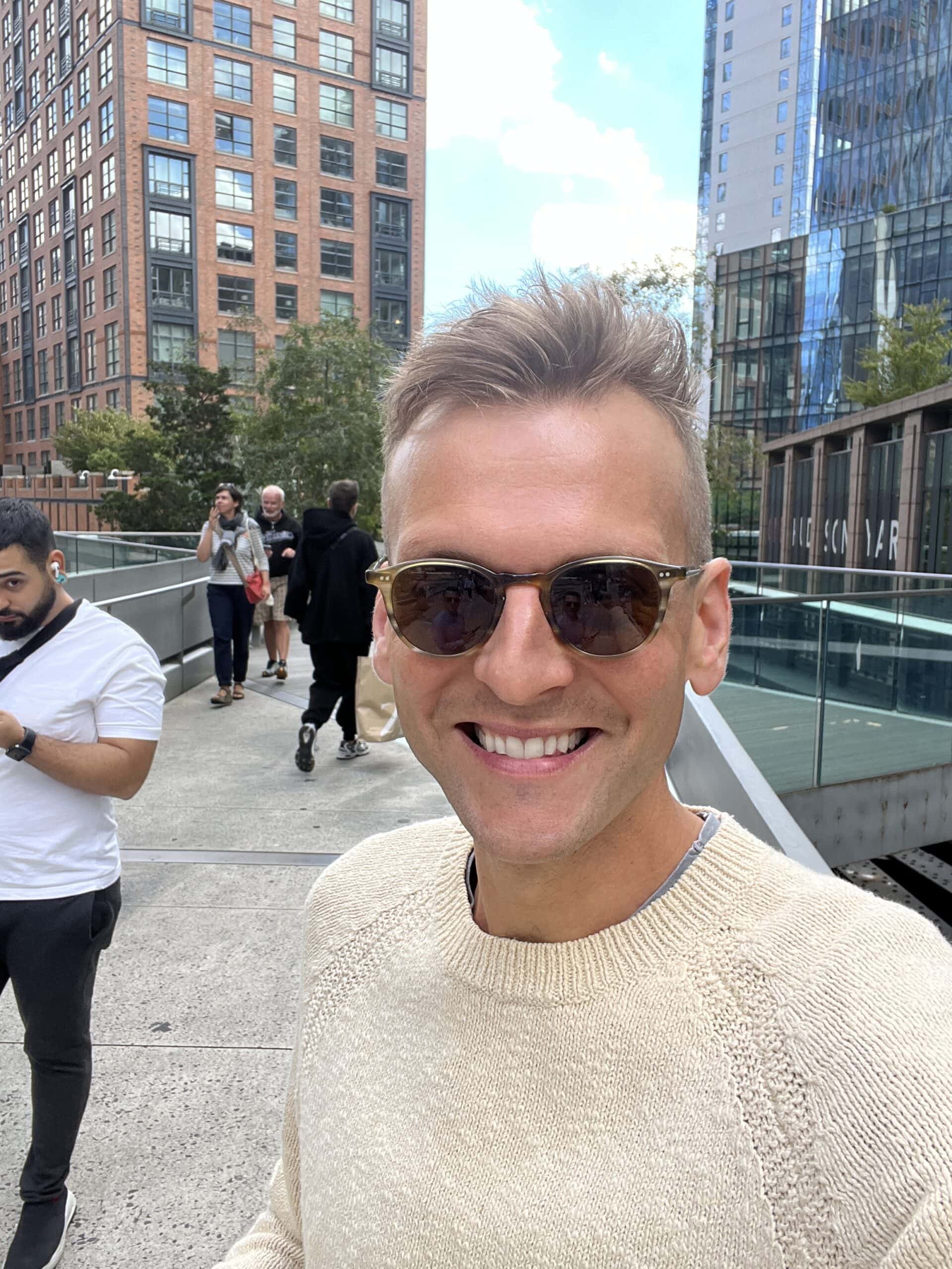 Kaleb Wyse taking a selfie with sunglasses on in NYC.
