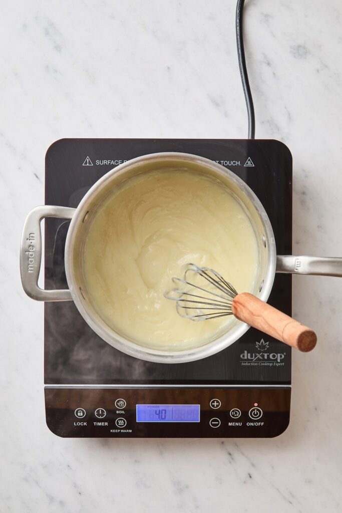 Thickened vanilla pudding mixture on hot plate.