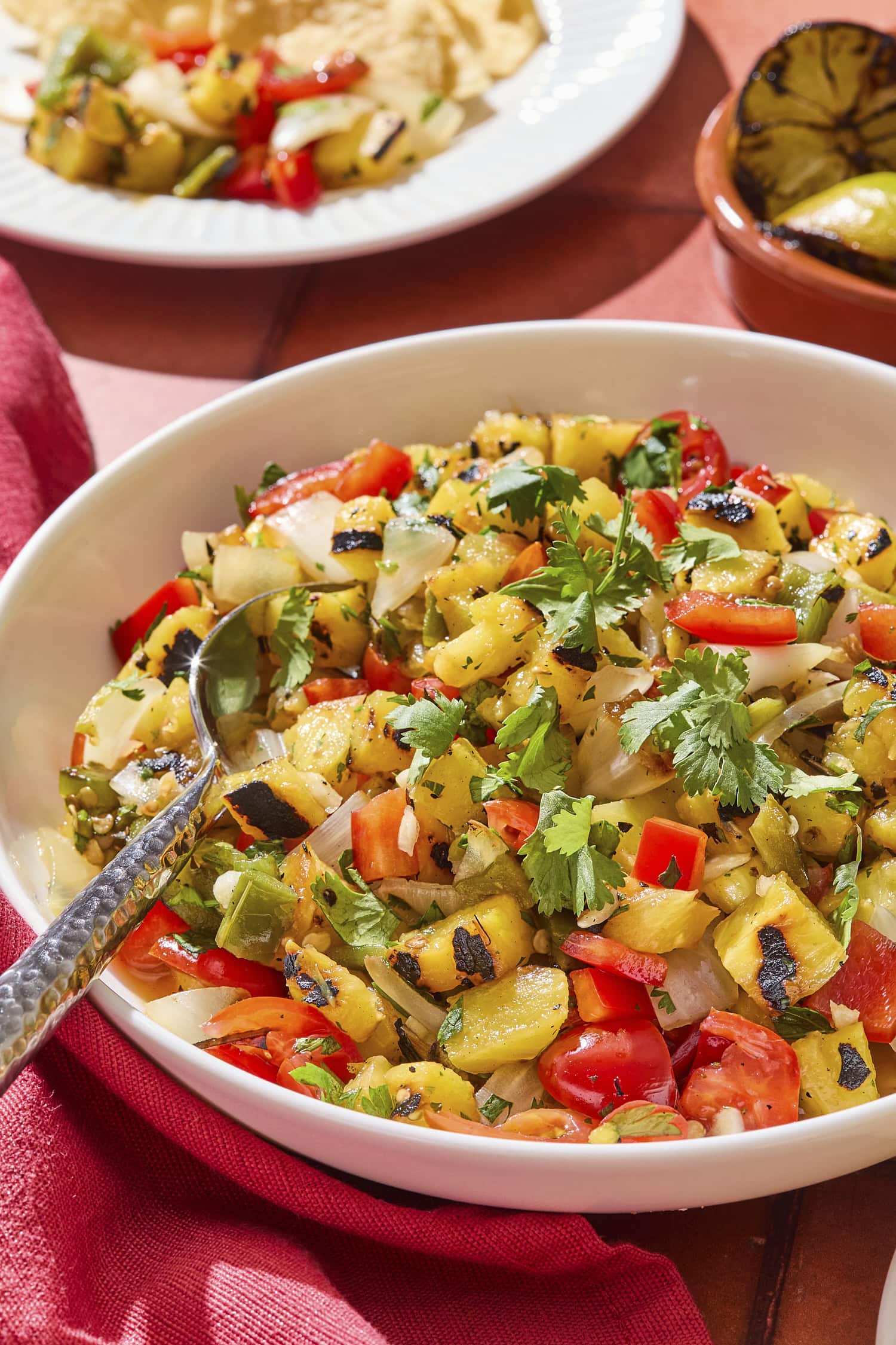 Bowl filled with pineapple salsa topped with fresh cilantro.