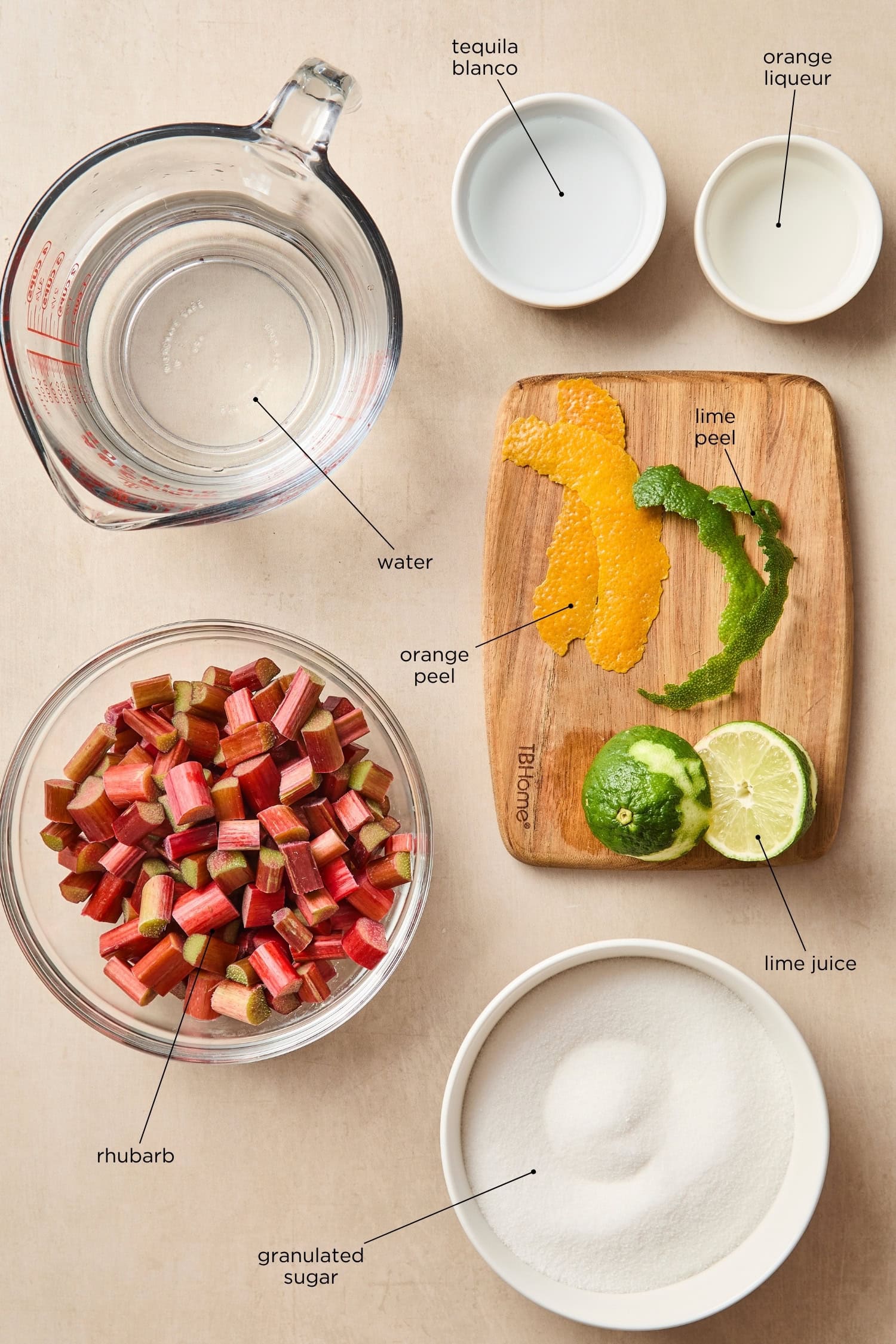 Surface filled with ingredients for a rhubarb margarita.