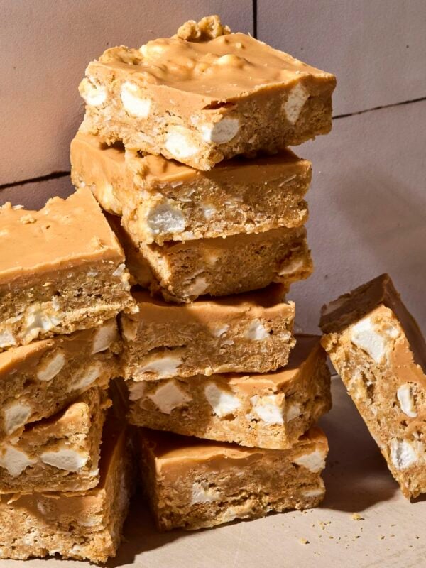 Stacked butterscotch bars with marshmallows showing and smooth topping.