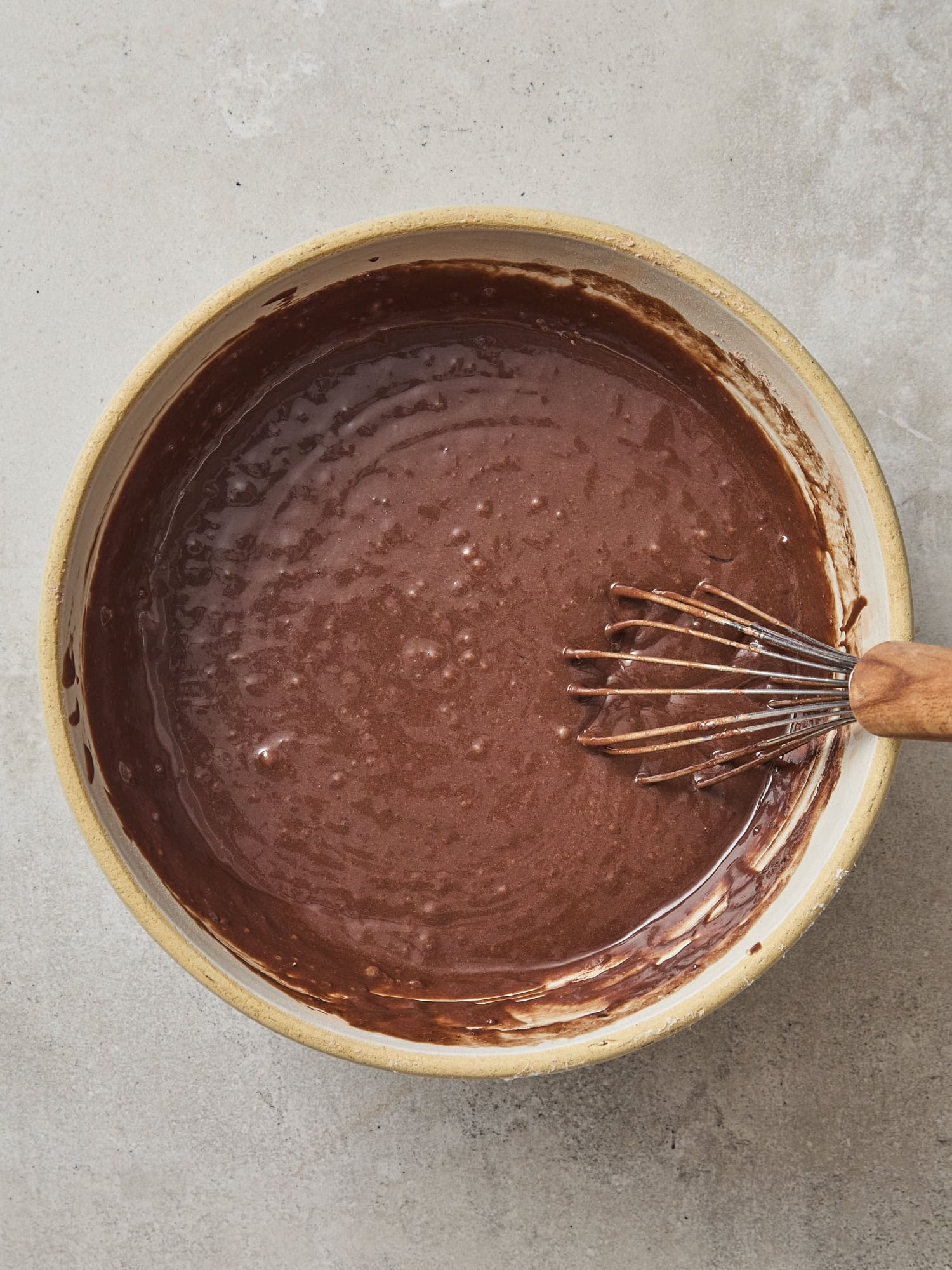 Bowl with chocolate batter for a cake.