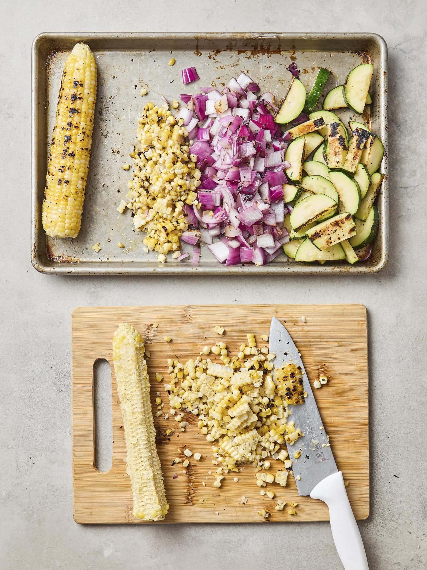 Grilled vegetables slicing into bite-sized pieces with char marks.