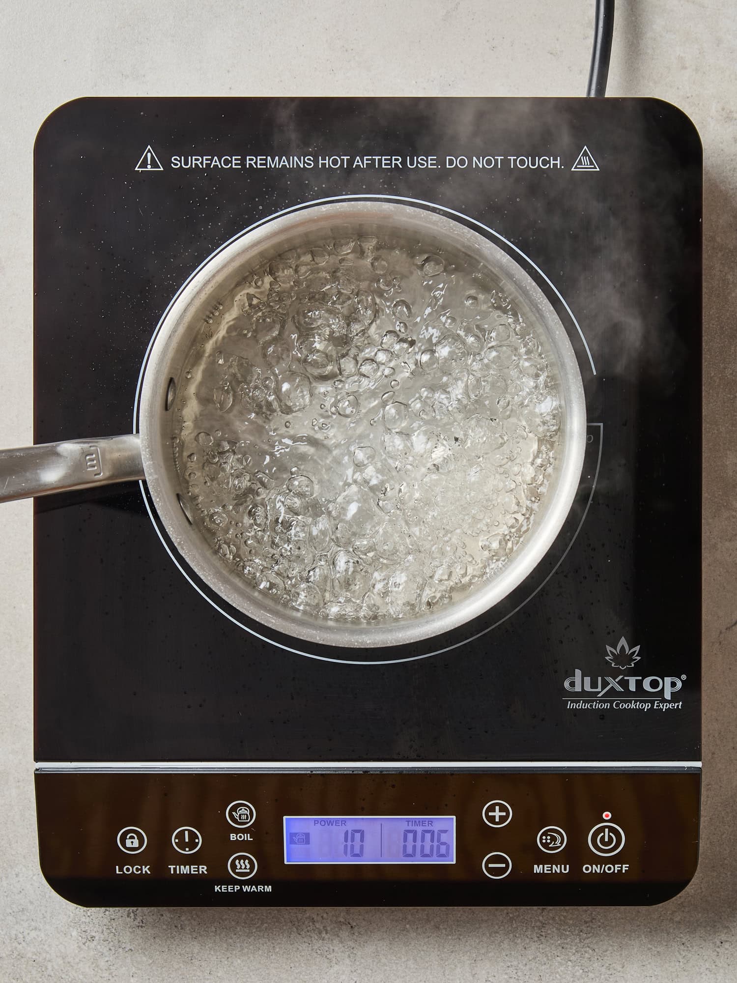 A simple brine comes to a boil on a stovetop.