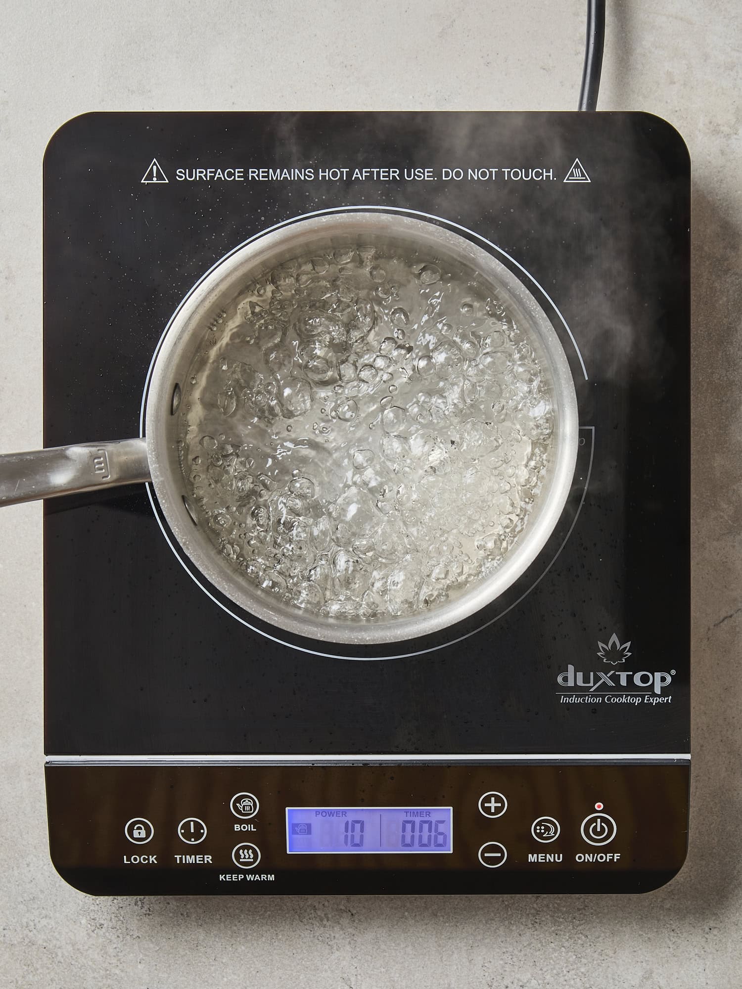Vinegar brine heating on a hot plate.