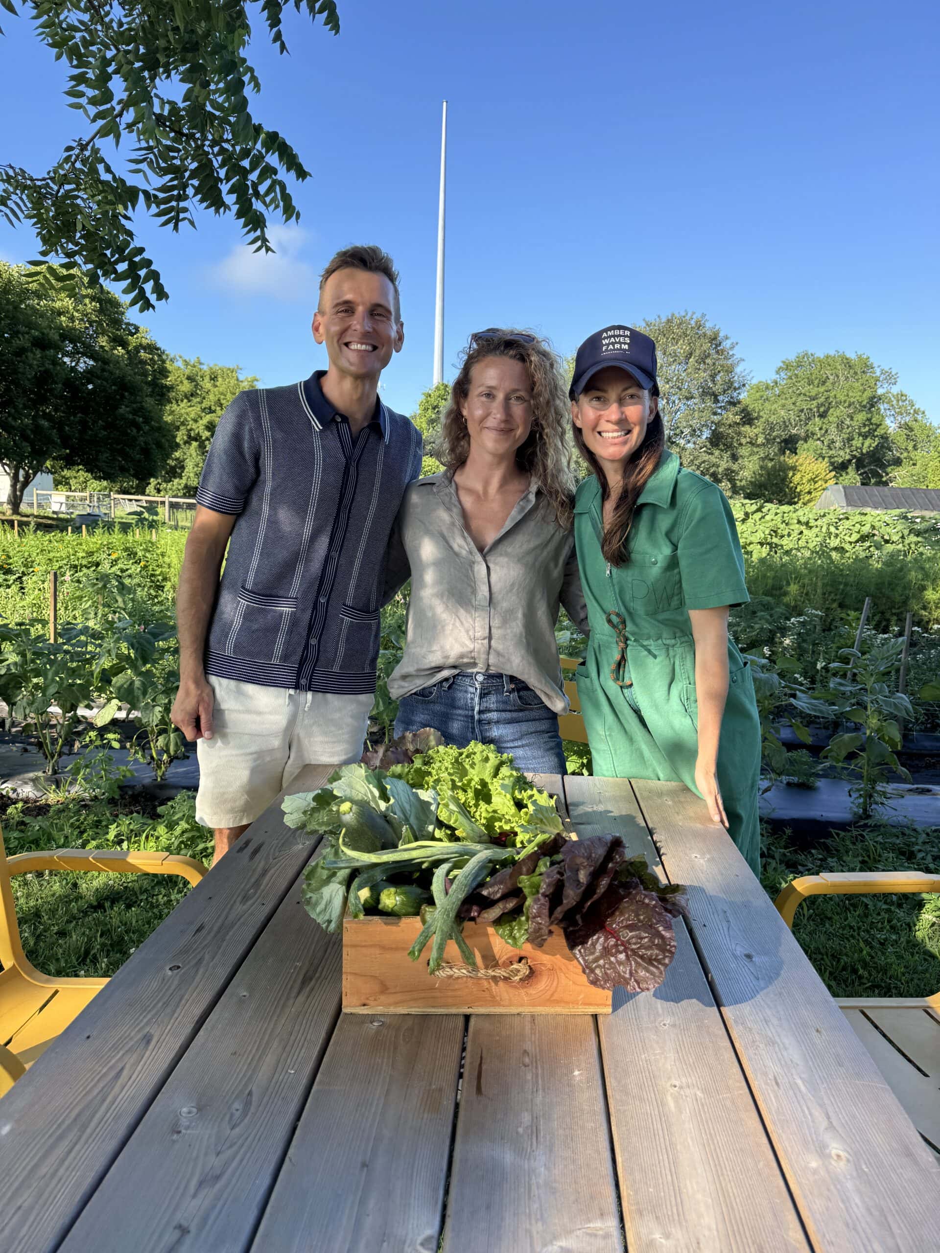 Kaleb standing with Amanda and Katie of Amber Waves Farm.